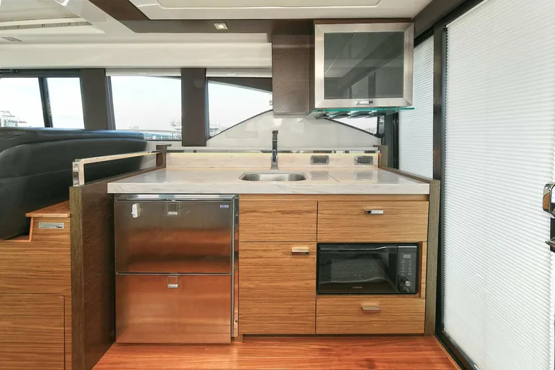 Double Diamond Yacht Photos Pics Modern kitchen in 2018 Tiara Yachts 39 Coupe with wood cabinetry and stainless steel appliances.