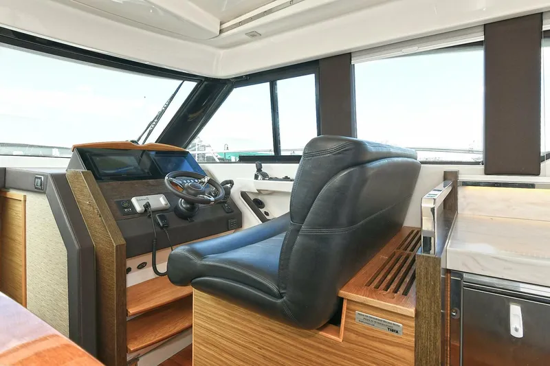 Double Diamond Yacht Photos Pics 2018 Tiara Yachts 39 Coupe helm with leather seat and modern controls.