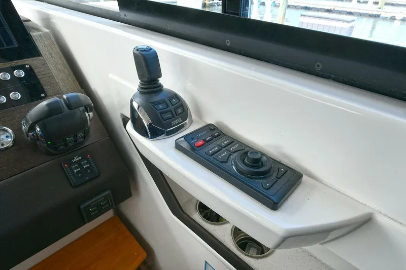 Double Diamond Yacht Photos Pics Control panel of 2018 Tiara Yachts 39 Coupe with joystick and navigation controls.