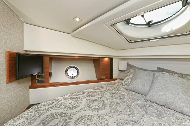 Double Diamond Yacht Photos Pics Luxurious cabin interior of 2018 Tiara Yachts 39 Coupe with skylight and cozy bedding.
