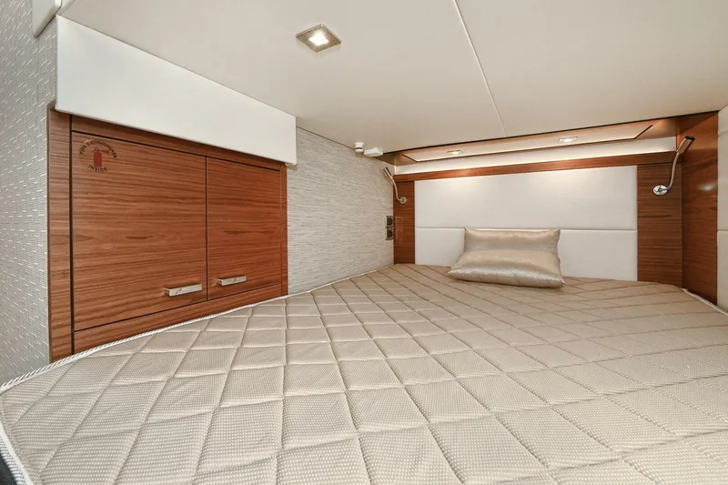 Double Diamond Yacht Photos Pics Luxurious cabin interior of 2018 Tiara Yachts 39 Coupe with elegant bedding and wood accents.