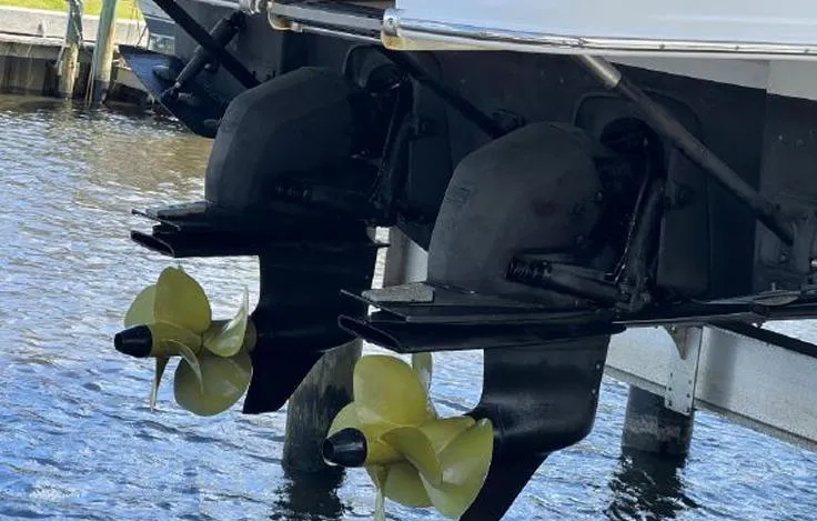  Yacht Photos Pics Twin propellers of a 2020 Jeanneau NC 37 boat in water.