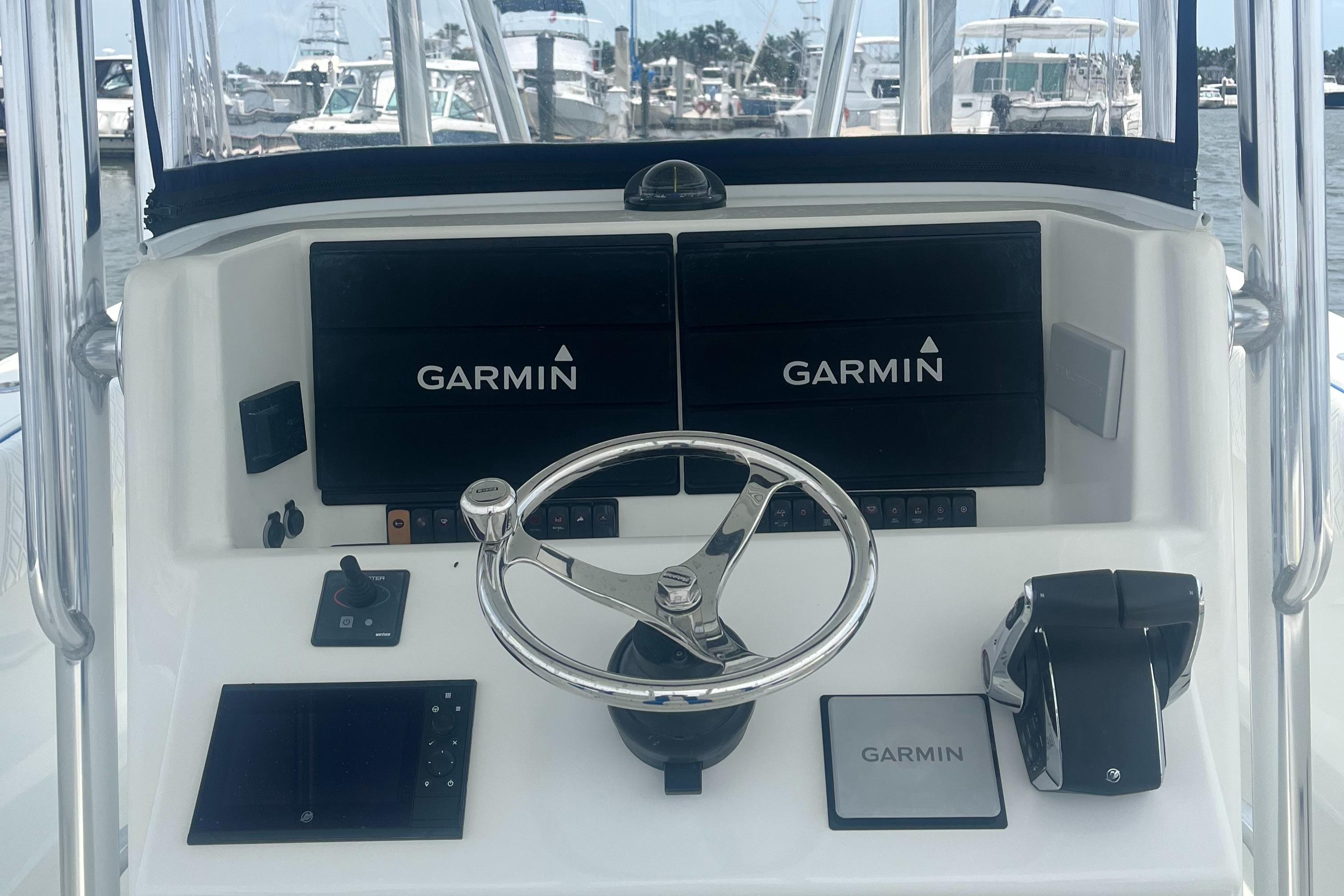 2016 Venture 39 Forward Seating boat dashboard with Garmin navigation displays.