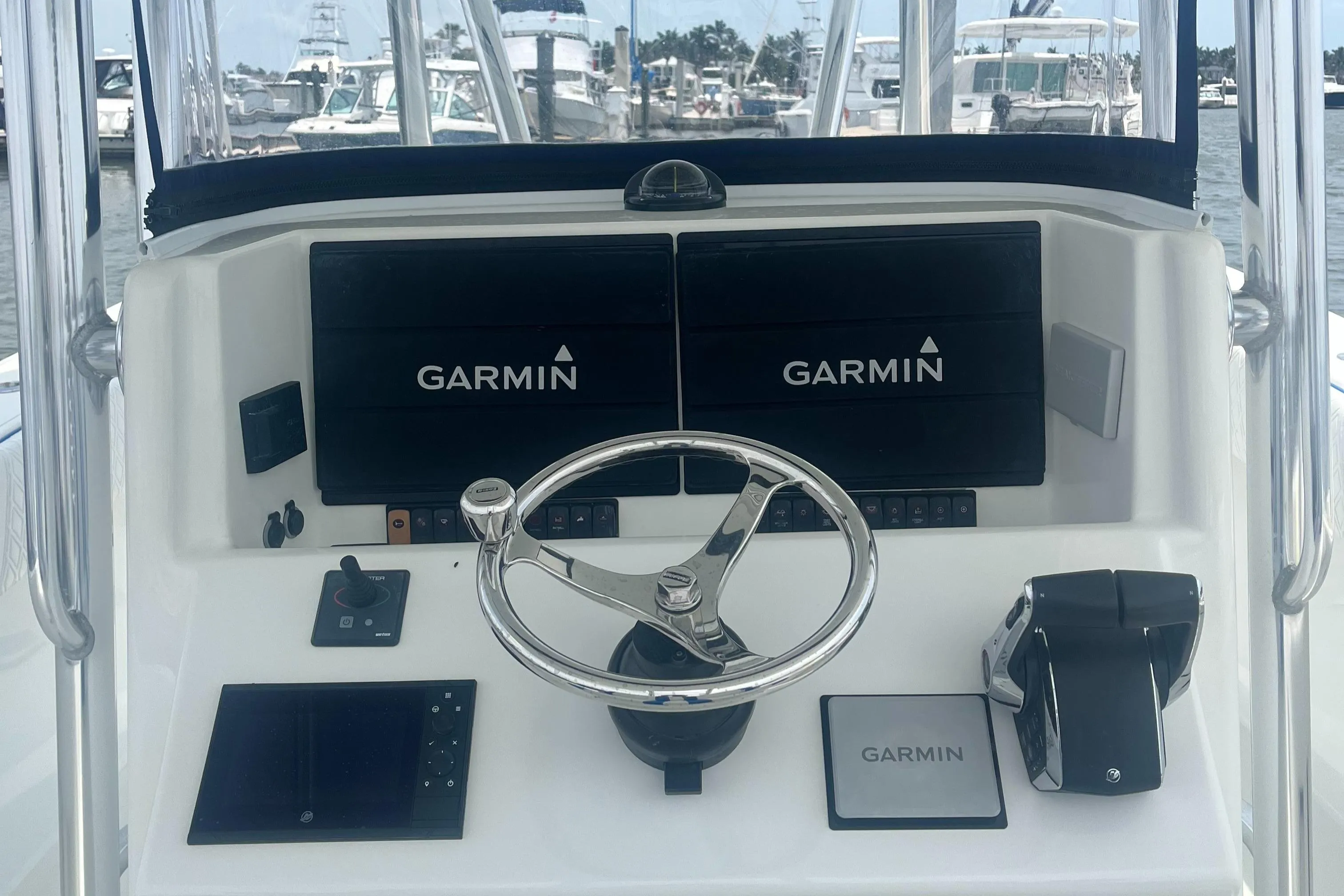 2016 Venture 39 Forward Seating boat dashboard with Garmin navigation displays.