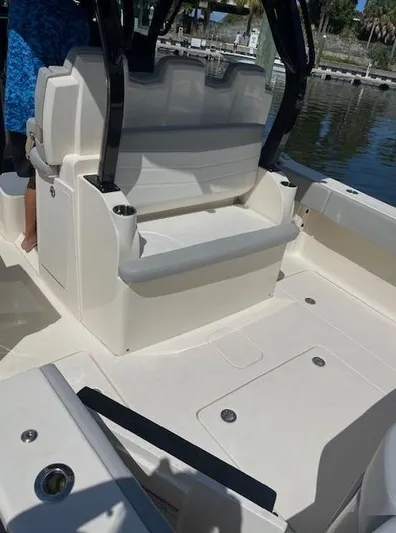 Ten Cent Yacht Photos Pics 2022 Scout 355 LXF CC boat interior with seating and cup holders.