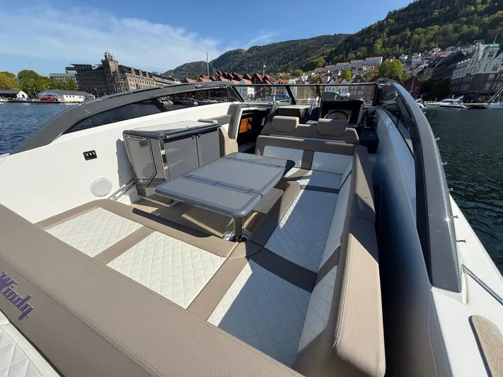  Yacht Photos Pics Luxurious 2023 Windy 37 Shamal yacht with spacious seating and scenic waterfront view.