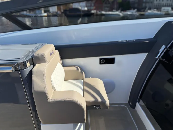  Yacht Photos Pics Luxury seating on 2023 Windy 37 Shamal yacht, featuring sleek design and premium materials.
