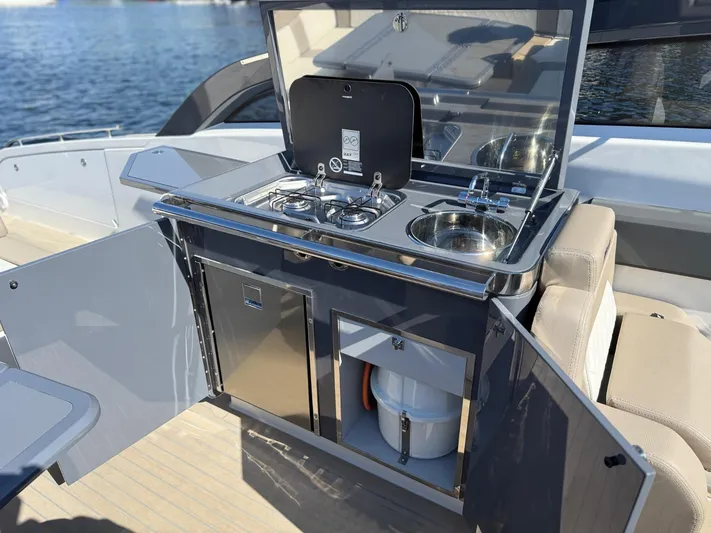  Yacht Photos Pics Outdoor kitchenette on 2023 Windy 37 Shamal yacht with stove and sink.