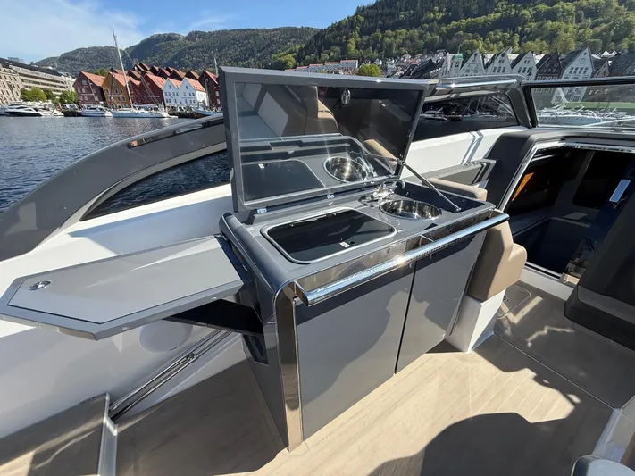  Yacht Photos Pics Luxury outdoor kitchen on 2023 Windy 37 Shamal yacht, featuring sleek design and modern amenities.