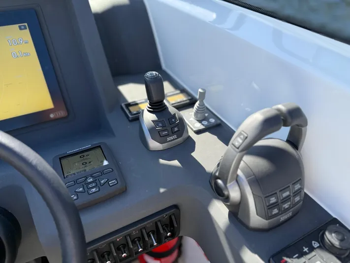  Yacht Photos Pics Control panel of 2023 Windy 37 Shamal boat with joystick and display.