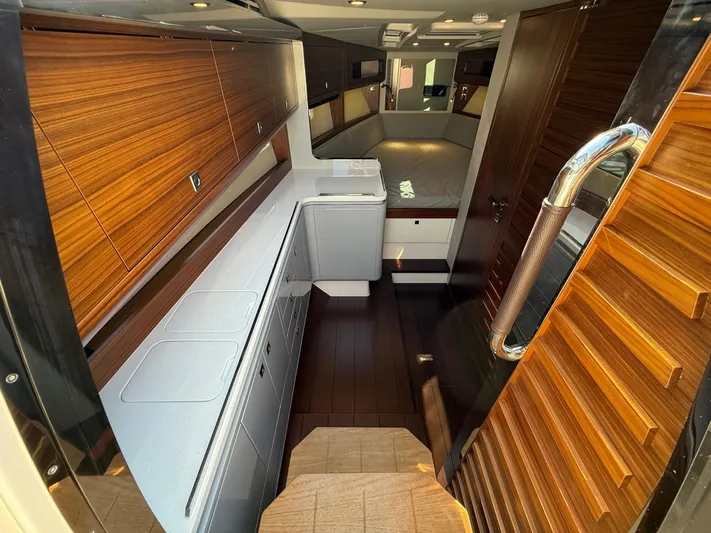  Yacht Photos Pics Luxurious interior of 2023 Windy 37 Shamal yacht with modern wood finishes and sleek design.