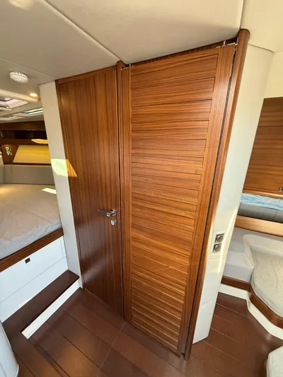  Yacht Photos Pics Interior of 2023 Windy 37 Shamal yacht with wooden finishes and cozy cabin space.