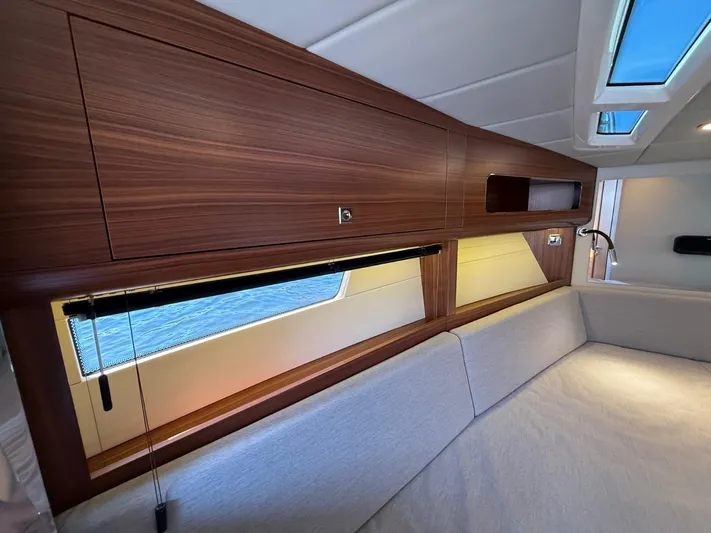  Yacht Photos Pics Interior of 2023 Windy 37 Shamal yacht with wooden cabinets and cozy seating.