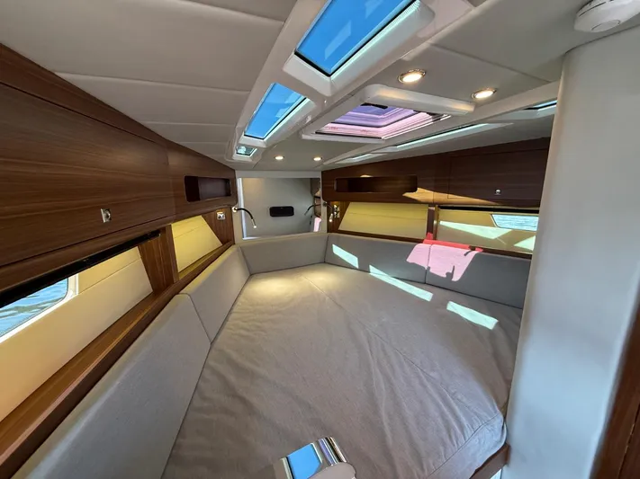  Yacht Photos Pics Luxurious interior of 2023 Windy 37 Shamal yacht with skylights and wood accents.