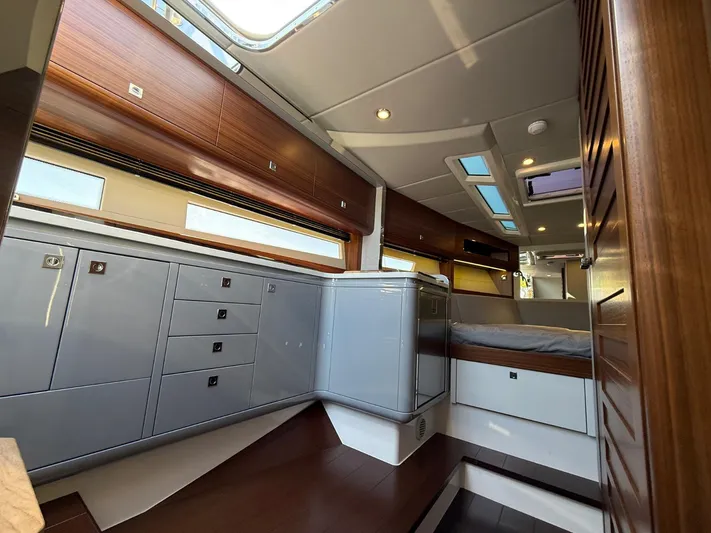  Yacht Photos Pics Luxurious interior of 2023 Windy 37 Shamal yacht with modern cabinetry and skylights.