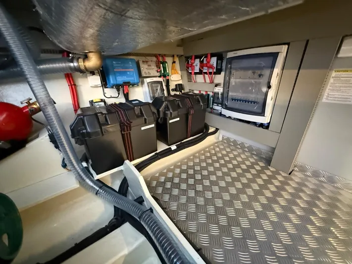  Yacht Photos Pics Engine room of 2023 Windy 37 Shamal with batteries and control panel.