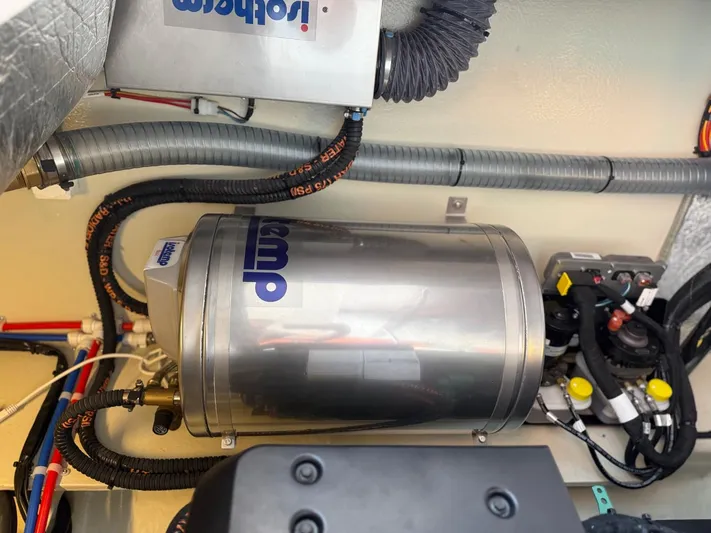  Yacht Photos Pics Engine compartment of 2023 Windy 37 Shamal, featuring a stainless steel component and wiring.