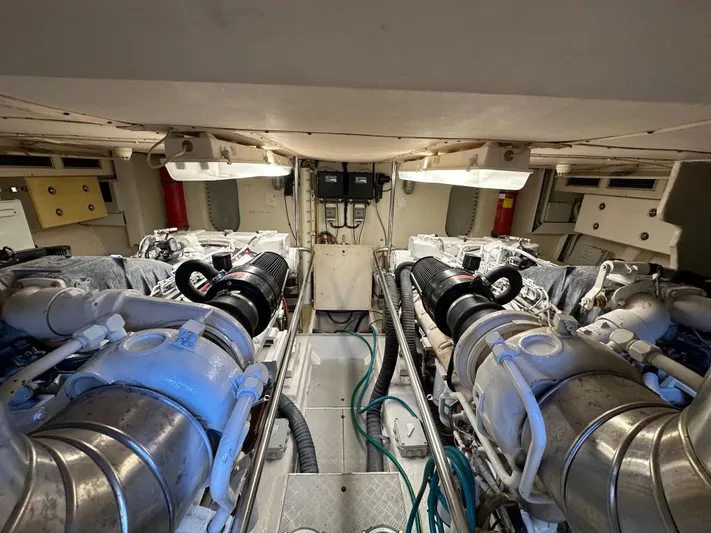  Yacht Photos Pics Engine room of a 1998 Ferretti Yachts 80, showcasing dual engines and mechanical components.