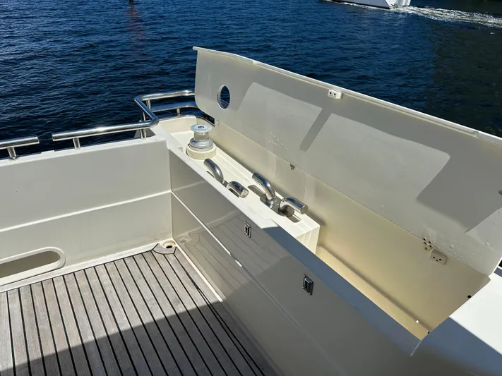  Yacht Photos Pics 1998 Ferretti Yachts 80 deck with railing and storage, overlooking the water.