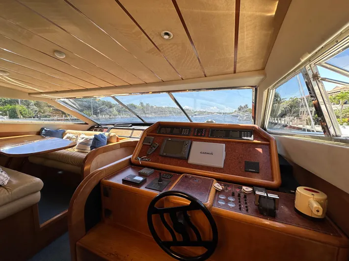  Yacht Photos Pics Interior view of 1998 Ferretti Yachts 80, featuring helm and seating area with scenic window views.