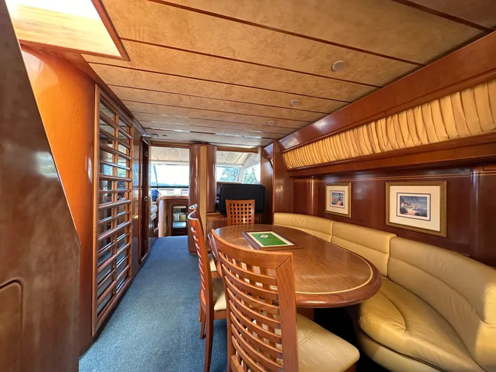  Yacht Photos Pics Luxurious interior of a 1998 Ferretti Yachts 80, featuring elegant wood and leather seating.