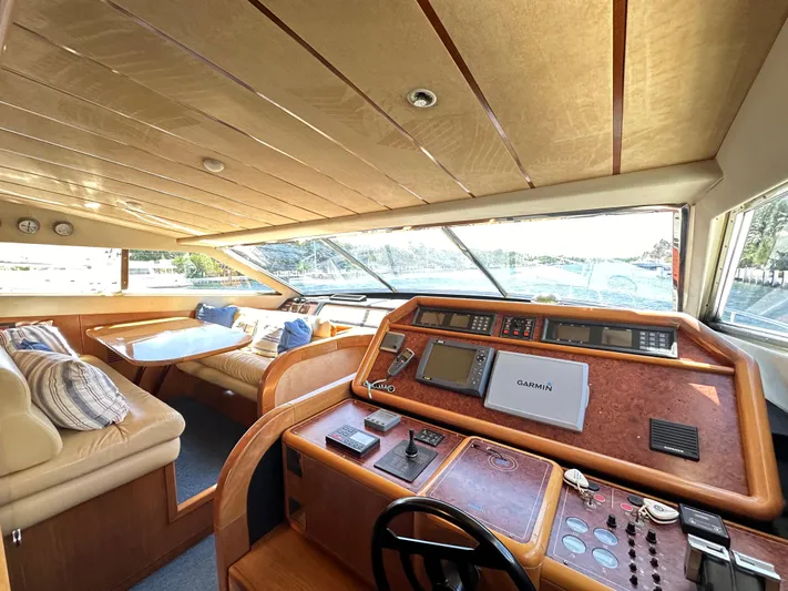  Yacht Photos Pics Interior of 1998 Ferretti Yachts 80, featuring helm and seating area with panoramic windows.
