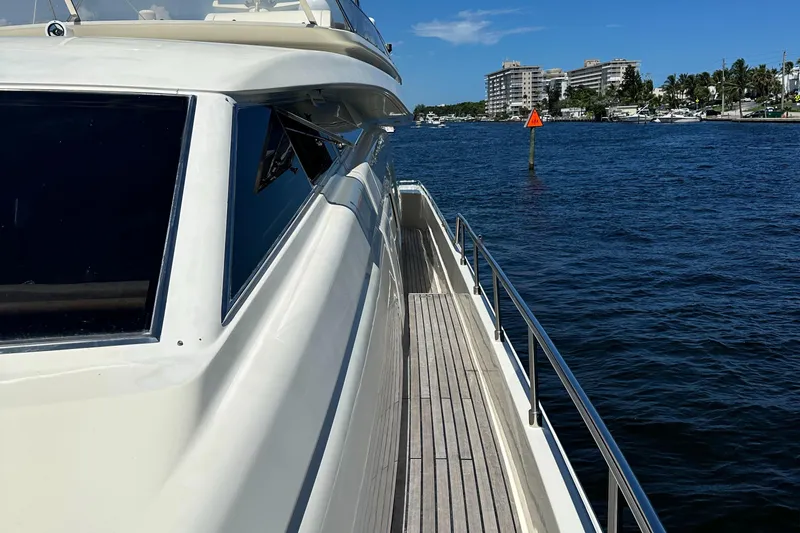 Yacht Photos Pics 1998 Ferretti Yachts 80 on water, side view, sunny day, coastal buildings in background.