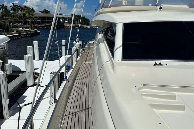  Yacht Photos Pics 1998 Ferretti Yachts 80 docked, showcasing sleek design and spacious deck.