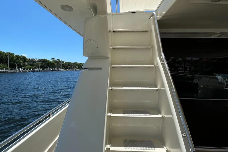  Yacht Photos Pics Staircase on 1998 Ferretti Yachts 80, overlooking serene waterfront.