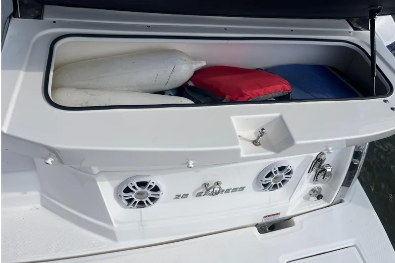  Yacht Photos Pics 2023 Regal 28 Express boat storage compartment with fenders and life jackets.
