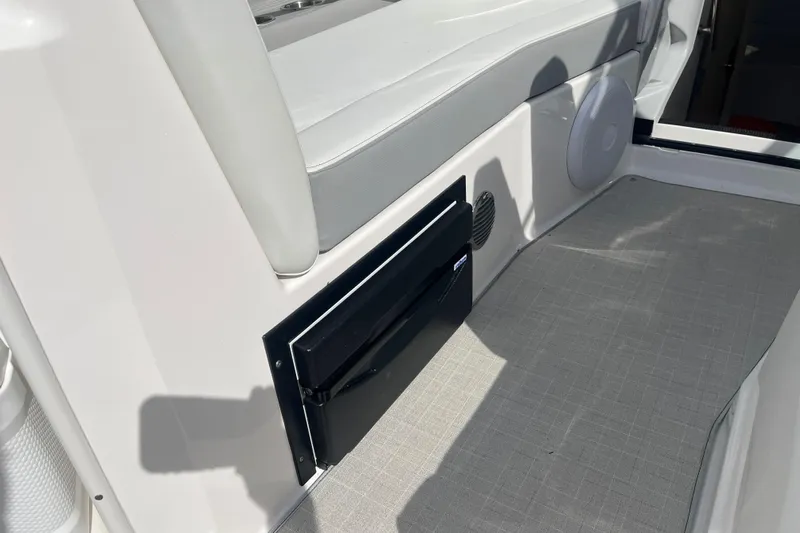  Yacht Photos Pics 2023 Regal 28 Express boat interior with seating and built-in speaker.