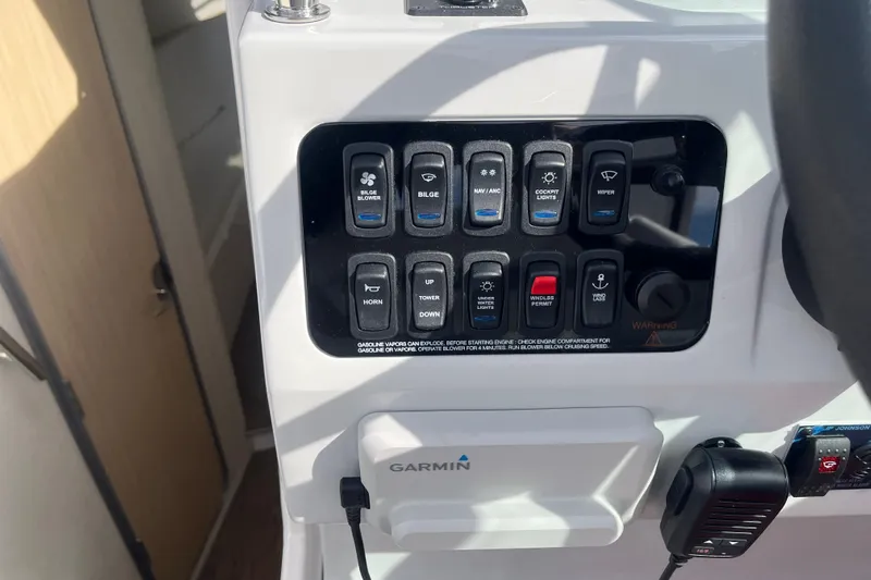  Yacht Photos Pics Control panel of 2023 Regal 28 Express boat with various switches and Garmin device.