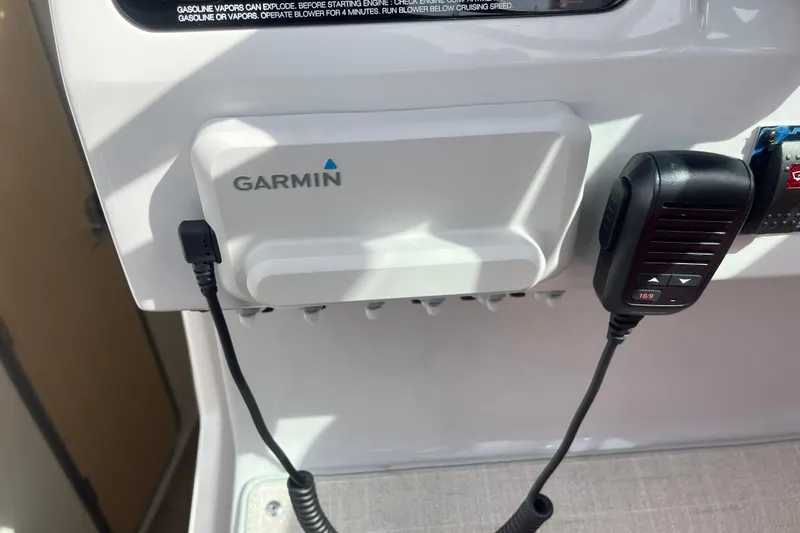  Yacht Photos Pics Garmin device and microphone on 2023 Regal 28 Express boat dashboard.