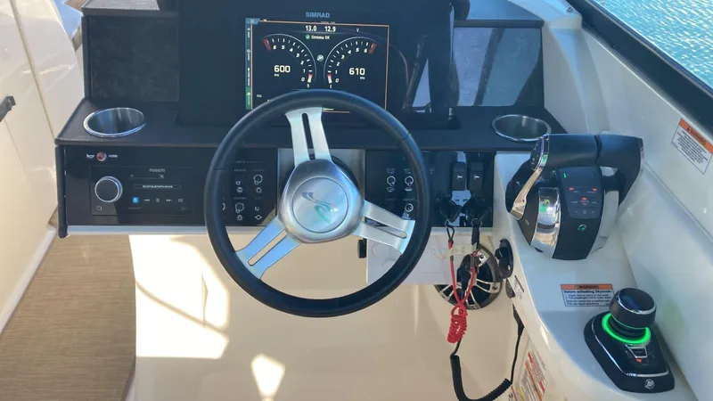 2020 Sea Ray 290 Sdx Ob Yacht Photos Pics 2020 Sea Ray SDX 290 Outboard helm with steering wheel and control panel.
