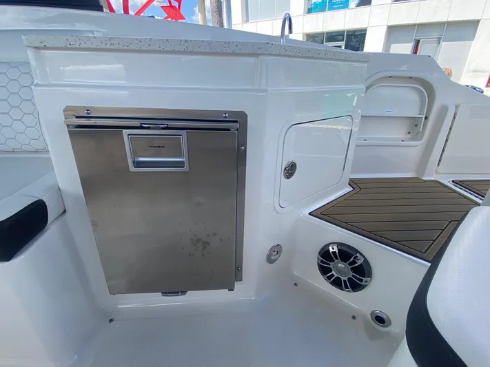 2020 Sea Ray 290 Sdx Ob Yacht Photos Pics 2020 Sea Ray SDX 290 Outboard boat interior with stainless steel fridge and speaker.