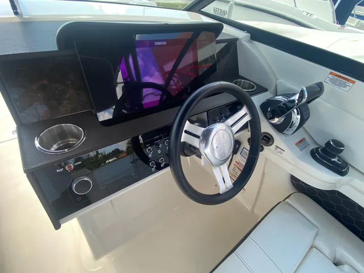 2020 Sea Ray 290 Sdx Ob Yacht Photos Pics 2020 Sea Ray SDX 290 Outboard helm with modern controls and sleek steering wheel.