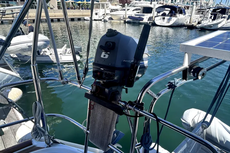 Dionysus Yacht Photos Pics 2003 Beneteau Oceanis Clipper 473 with outboard motor in marina setting.