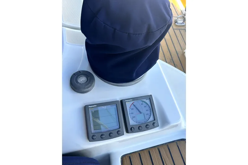 Dionysus Yacht Photos Pics Beneteau Oceanis Clipper 473 yacht cockpit instruments, 2003 model, featuring Raymarine displays.