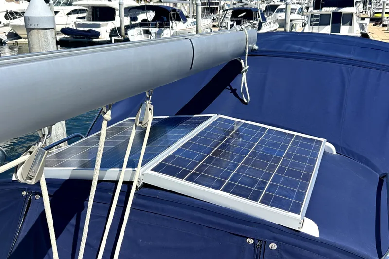 Dionysus Yacht Photos Pics Solar panels on a 2003 Beneteau Oceanis Clipper 473 sailboat, docked at a marina.