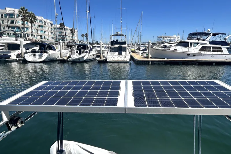 Dionysus Yacht Photos Pics Solar panels on a 2003 Beneteau Oceanis Clipper 473 in a marina setting.