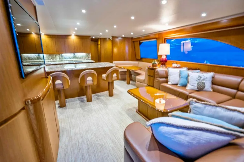 Last Call Yacht Photos Pics Luxurious interior of 2011 Viking 70 Enclosed Bridge yacht with elegant seating and modern decor.