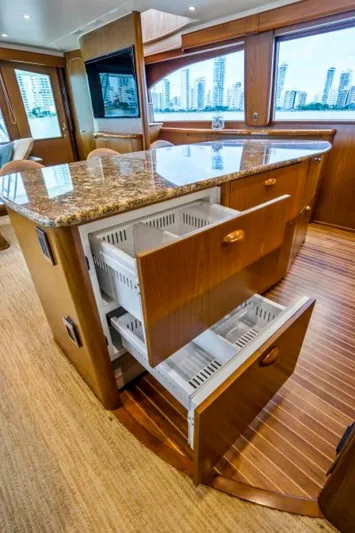 Last Call Yacht Photos Pics Luxurious 2011 Viking 70 yacht interior with open drawers and granite countertop.