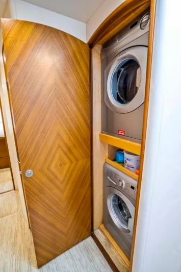 Last Call Yacht Photos Pics Stacked washer and dryer in 2011 Viking 70 Enclosed Bridge yacht.