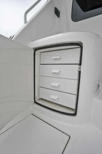 Last Call Yacht Photos Pics 2011 Viking 70 Enclosed Bridge yacht storage drawers, open compartment view.