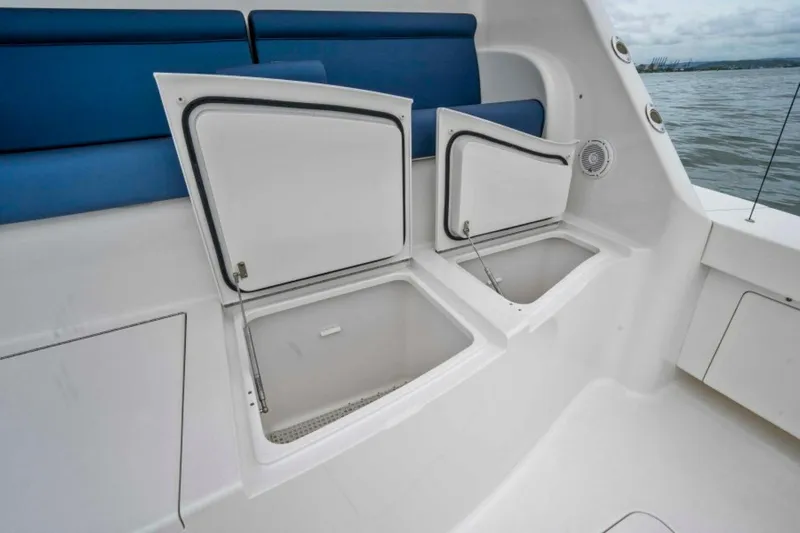 Last Call Yacht Photos Pics Open storage compartments on 2011 Viking 70 Enclosed Bridge yacht deck.