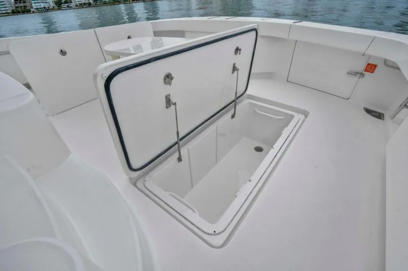 Last Call Yacht Photos Pics Open storage compartment on 2011 Viking 70 Enclosed Bridge yacht deck.