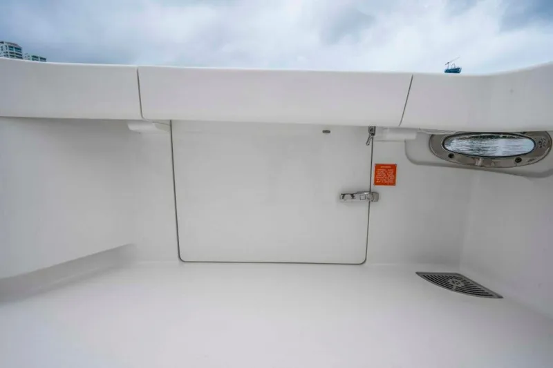 Last Call Yacht Photos Pics 2011 Viking 70 Enclosed Bridge yacht interior with white panel and porthole.