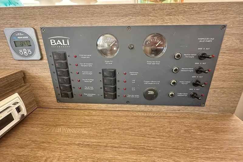  Yacht Photos Pics Control panel of a 2016 Bali Catamarans Bali 4.0, featuring switches and gauges.