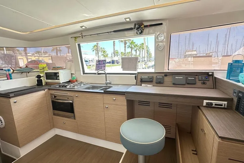  Yacht Photos Pics Interior of 2016 Bali 4.0 catamaran kitchen with modern appliances and navigation controls.
