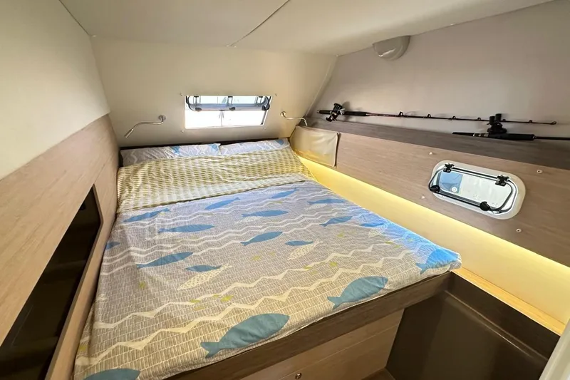  Yacht Photos Pics Cozy cabin interior of 2016 Bali 4.0 catamaran with bed and window.